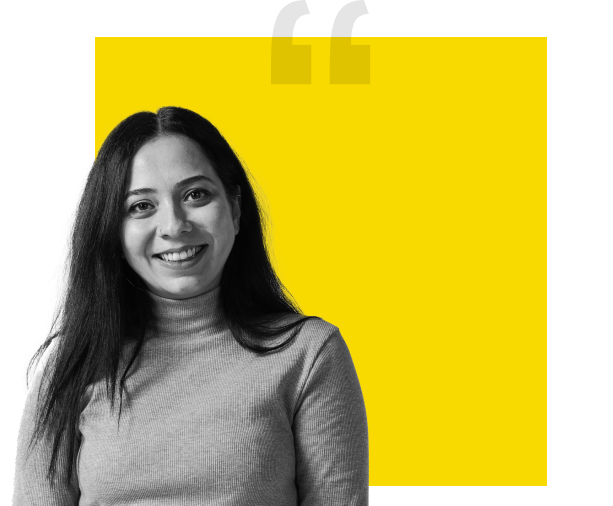 black and white image of woman in front of yellow background